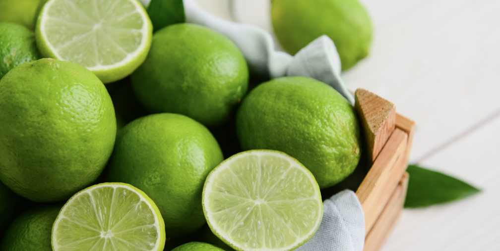 limes-slide-cut-limes Wooden box holding fresh cut and whole limes