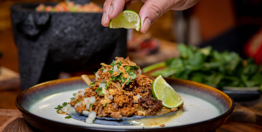 limes-slide-meal Dinner plate with lime being squeezed over the dish